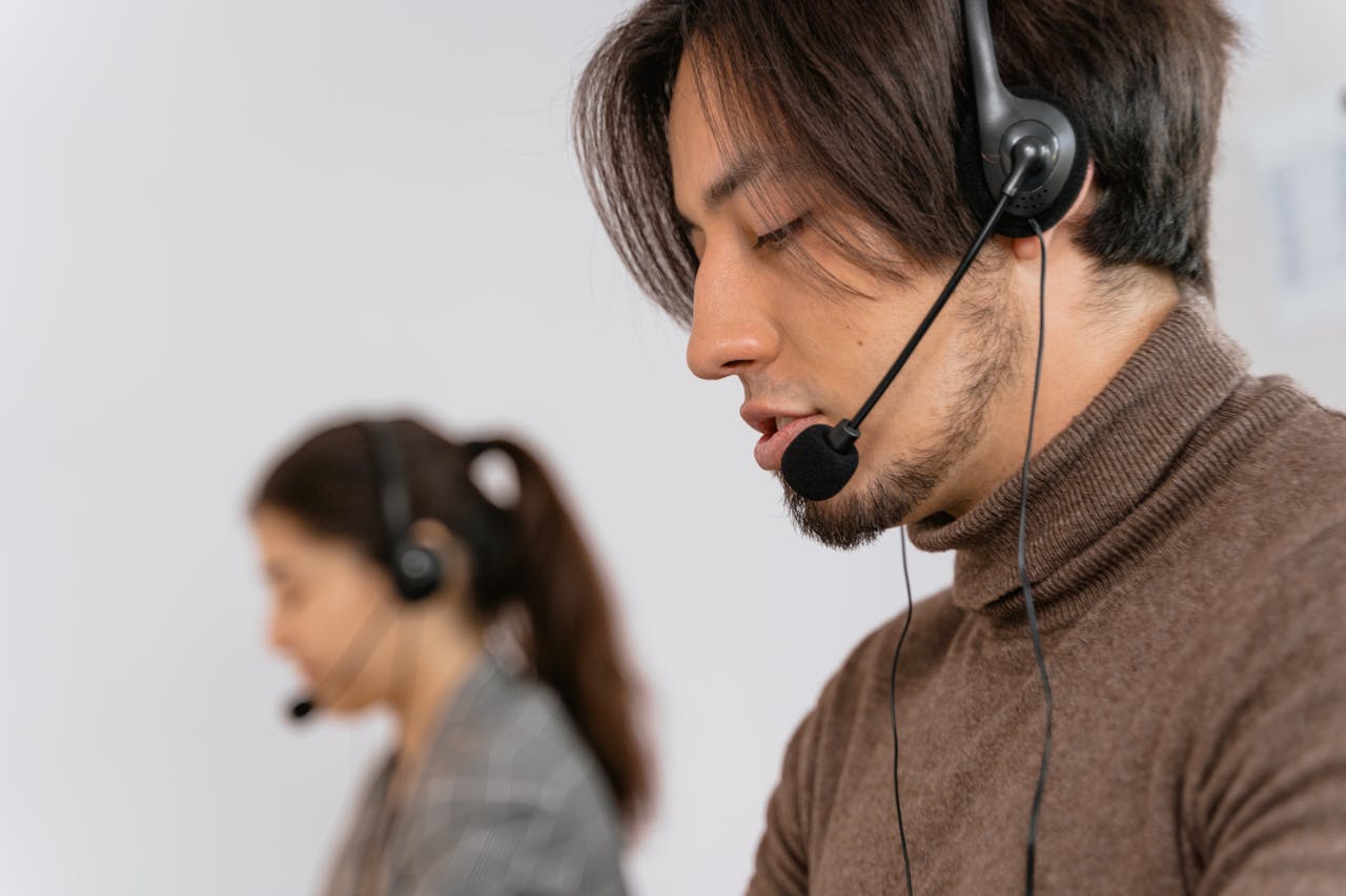 heros-img Focused call center employees wearing headsets, assisting customers with exceptional service.